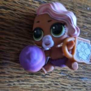 L.O.L. Surprise! Baby Doll with Pink Hair and Purple Outfit